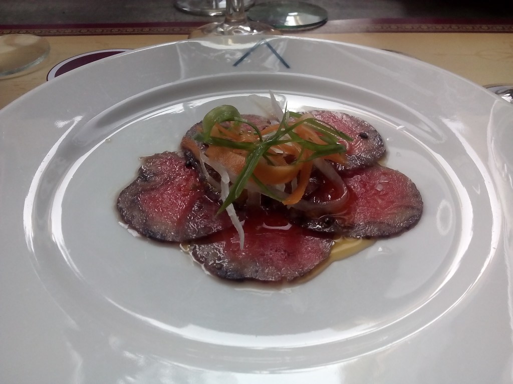 Beef carpaccio: red wine cured, shaved ginger, togarashi spice